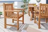 Outdoor patio furniture set on a wooden deck with a beach and ocean in the background. Produktbild-Vorschau