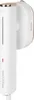 A white handheld garment steamer with gold accents, mounted on a wall bracket. Náhled obrázku produktu
