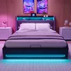 A modern bedroom with a bed featuring LED lighting and storage. Produktbild-Vorschau