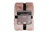 A folded pink blanket with a product label attached. Produktbild-Vorschau