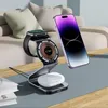 A charging stand with a smartphone, smartwatch, and earbuds on a table. Náhled obrázku produktu