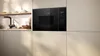 A built-in microwave in a modern kitchen setting. Náhľad obrázku produktu