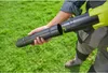 A person is assembling a leaf blower in a grassy yard. Produktbild-Vorschau