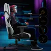 A young man wearing headphones sits in a gaming chair, with feature callouts. Náhľad obrázku produktu