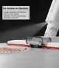 Close-up of a white cleaning device spraying water onto a floor with a red cleaning pad. Produktbild-Vorschau