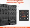A black pegboard organizer with various hooks and bins attached, shown with a close-up diagram of peg hole dimensions. Podgląd zdjęcia produktu