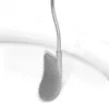 A close-up view of a toilet brush head and part of its handle, positioned over the rim of a white toilet bowl. Podgląd zdjęcia produktu