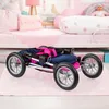 A doll stroller is shown folded on a pink rug in a child's bedroom. Produktbild-Vorschau