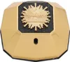 A gold-colored perfume bottle with a black and gold emblem on the front. Anteprima dell’immagine prodotto