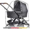 A close-up view of a baby stroller with a rain cover. Produktbild-Vorschau