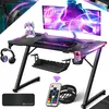 A gaming desk setup with a monitor, keyboard, mouse, headphones, and accessories, illuminated by LED lights. Produktbild-Vorschau