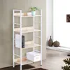 A white and light wood bookshelf with items on it, placed against a light gray wall next to a window. Náhľad obrázku produktu