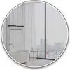 A modern bathroom with a freestanding bathtub and a large window overlooking a city skyline. Náhľad obrázku produktu