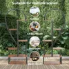 A plant stand with multiple shelves, shown in a garden setting with inset images showing its use in a living room, bedroom, and study room. Produktbild-Vorschau