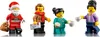 Four LEGO minifigures dressed for winter and Christmas, including Santa Claus, a mail carrier, and two people holding mugs. Podgląd zdjęcia produktu