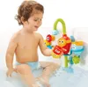 A young child is playing with a bath toy in a bathtub. Podgląd zdjęcia produktu