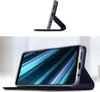 A smartphone case is shown in two different orientations, one standing up and the other lying flat with the phone inside. Produktbild-Vorschau