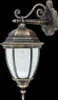 A classic outdoor wall lamp with a gold-colored metal frame and clear glass panels. Voir les images du produit