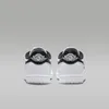 A pair of Nike Jordan 1 Retro Low '85 sneakers shown from the back. Náhled obrázku produktu