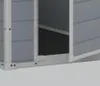 A close-up view of the corner of a gray plastic garden shed with white trim. Náhľad obrázku produktu