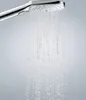 A close-up of a shower head with water spraying out. Anteprima dell’immagine prodotto