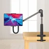 A tablet holder clamped to a wooden table, with a tablet displaying a colorful wallpaper. Náhľad obrázku produktu
