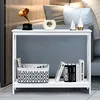 A white console table with a shelf, decorated with a vintage gramophone, a decorative vase, two decorative trees, a storage basket, and books. The table is placed in a living room setting, next to a sofa. Podgląd zdjęcia produktu
