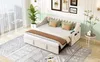 A bedroom scene with a sofa bed, rug, plant, and artwork on the wall. Anteprima dell’immagine prodotto