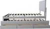 A side view of a grey upholstered bed frame with a slatted mattress support and three drawers underneath. Produktbild-Vorschau