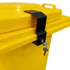 A close-up shot of a black lock with keys attached to a yellow trash can lid. Produktbild-Vorschau