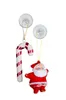 Two Christmas ornaments, a candy cane and Santa Claus, hanging from suction cups. Produktbild-Vorschau
