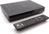 A black satellite receiver and its remote control are shown on a white background. Podgląd zdjęcia produktu