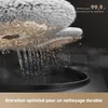 Close-up of cleaning pads with water flowing through them, suggesting a cleaning function. Voir les images du produit