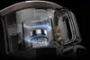 A cutaway view of a vacuum cleaner's dustbin, showing the cyclonic action and collected debris. Náhled obrázku produktu