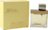 Dsquared² She Wood Golden Light Wood Parfum 30 ml – eckiger Flakon mit Holzverschluss neben gelber Kartonverpackung. Produktbild-Vorschau
