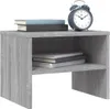 A bedside table with books and an alarm clock on top. Produktbild-Vorschau