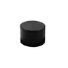 A black cylindrical object with multiple stacked sections, isolated on a white background. Produktbild-Vorschau
