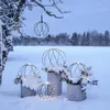 Decorative spheres with lights in a snowy outdoor setting. Produktbild-Vorschau
