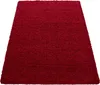 A red shaggy rug on a white background. Produktbild-Vorschau