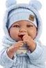 A close-up studio shot of a baby doll wearing a blue knitted outfit and hat. Produktbild-Vorschau