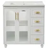 A white bathroom vanity with a ceramic sink and gold hardware. Produktbild-Vorschau