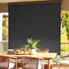 An outdoor dining set with a large dark gray roller blind covering the background. Voir les images du produit