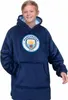 A young boy wearing a dark blue Manchester City FC hoodie. Produktbild-Vorschau