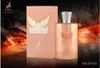 A perfume bottle and its box are displayed against a dark, fiery background. Voir les images du produit
