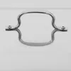 A close-up shot of a silver handle attached to a white surface, likely a pot or dish lid. Podgląd zdjęcia produktu