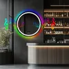 A modern bathroom or bar setting with a round LED mirror. Anteprima dell’immagine prodotto