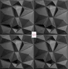 A grid of four dark gray 3D geometric wall panels. Produktbild-Vorschau