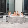 A family enjoying a hot tub on a patio. Produktbild-Vorschau