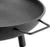 Close-up of a black metal fire pit with a handle and a leg. Anteprima dell’immagine prodotto