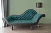 A teal chaise lounge is placed next to a grey curtain and a floor lamp against a light green wall. Produktbild-Vorschau